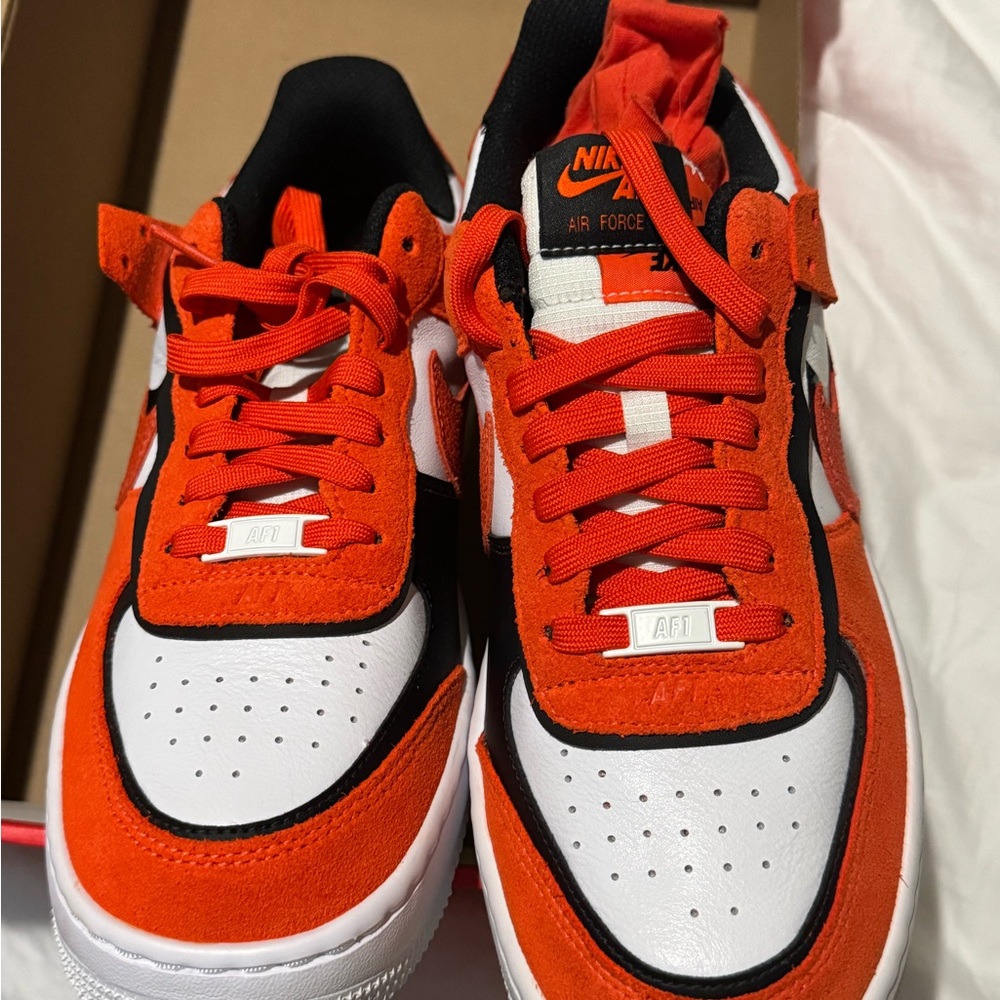 Nike Orange and White Sneakers with Iconic Design